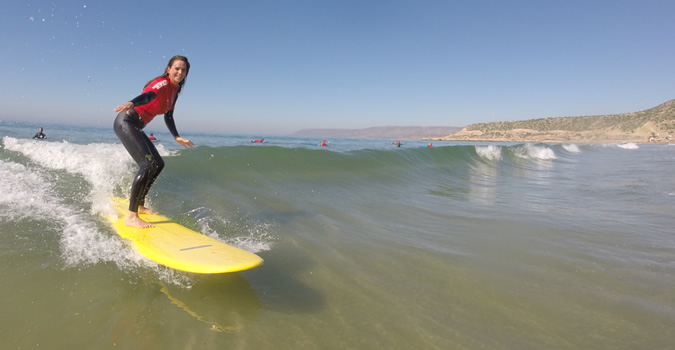 Beginner surf lessons in comfortable conditions.
